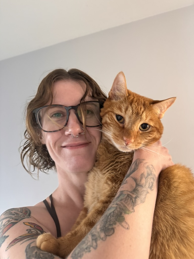 Morgen holding her orange cat